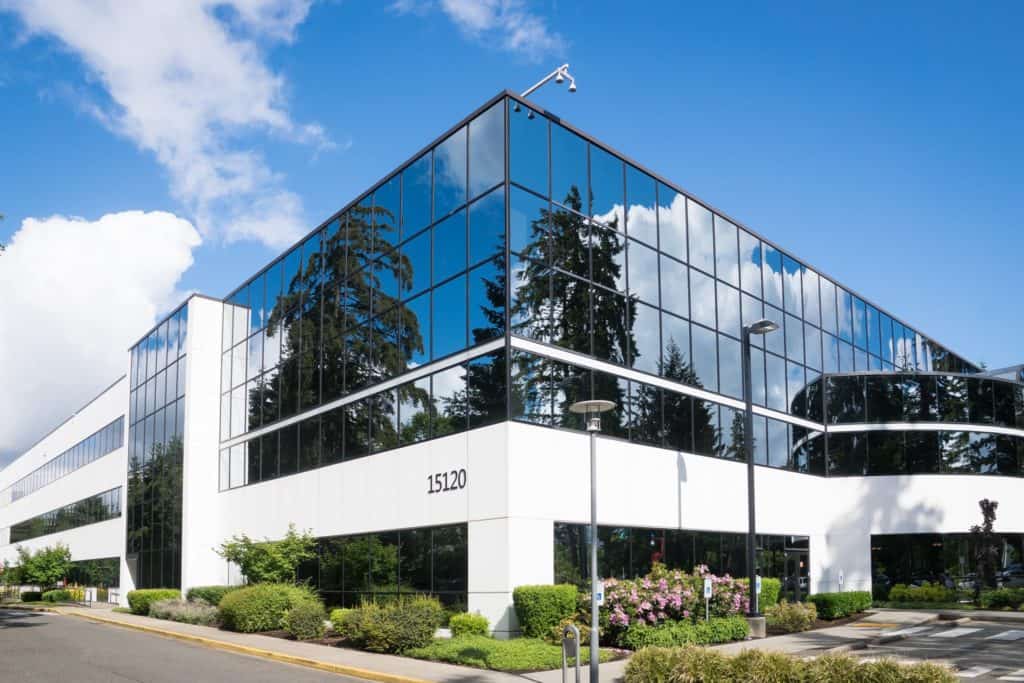 Photos of a mirrored office building on the corner