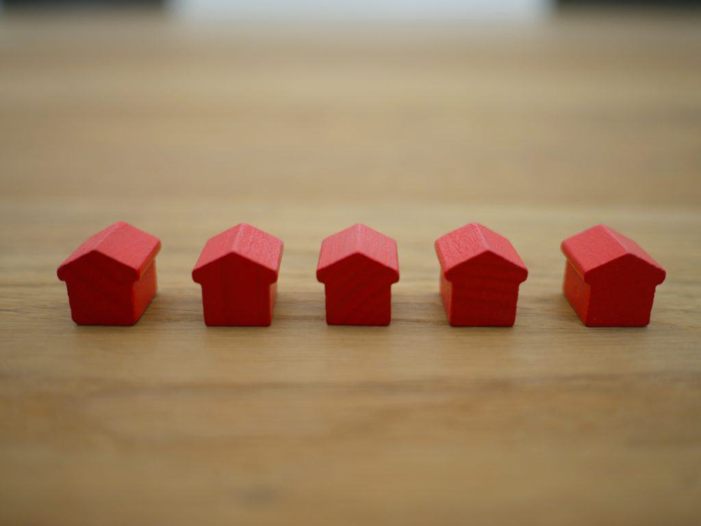 little red houses sitting on a table expert management