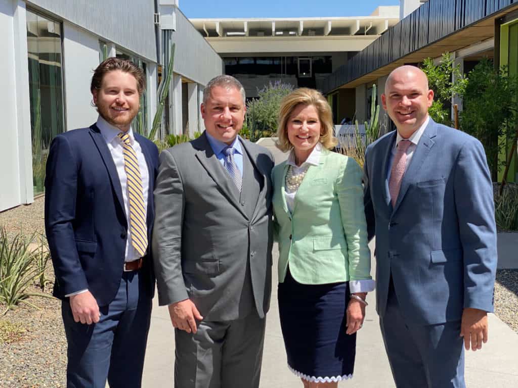 Plaza Companies team standing outside