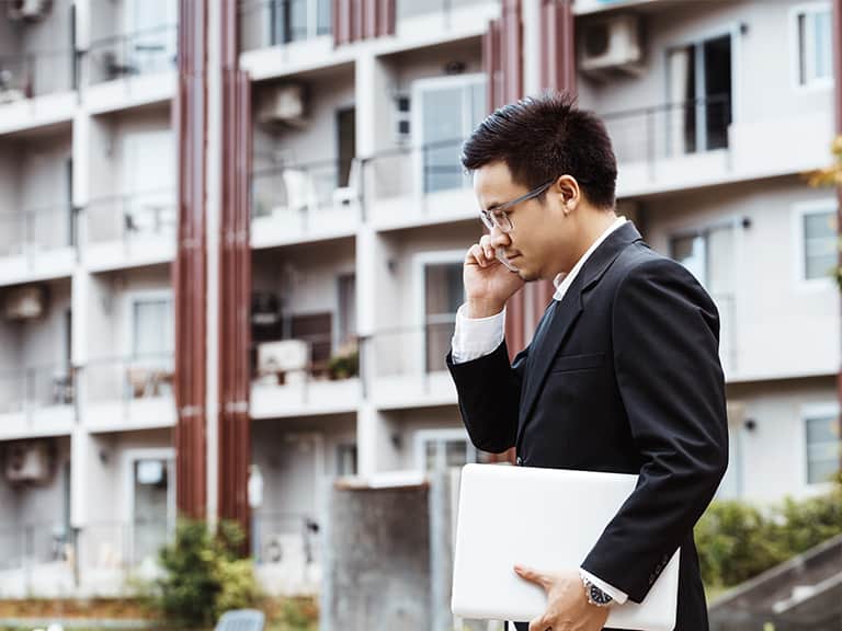 A business professional talking on the phone about Property Management