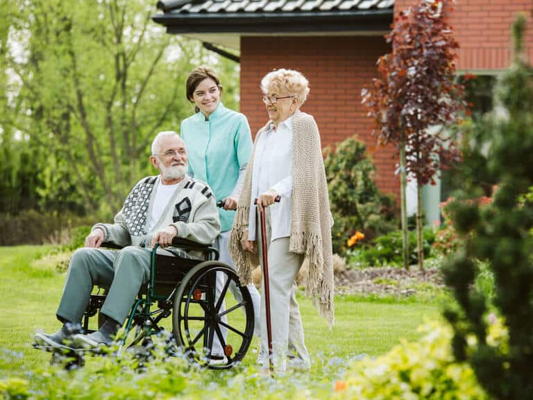 Senior man in wheelchair outside of senior living facilities